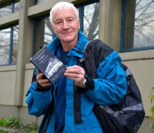 The author Carl Flint holding the illustrated walking guide to Ledbury